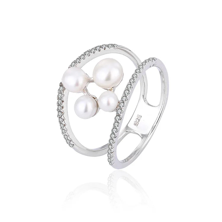 Minimalist simple irregular freshwater pearl engagement ring with diamonds around it